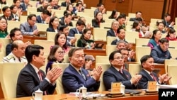 Vietnam parliament approves radical government cost-cutting drive 