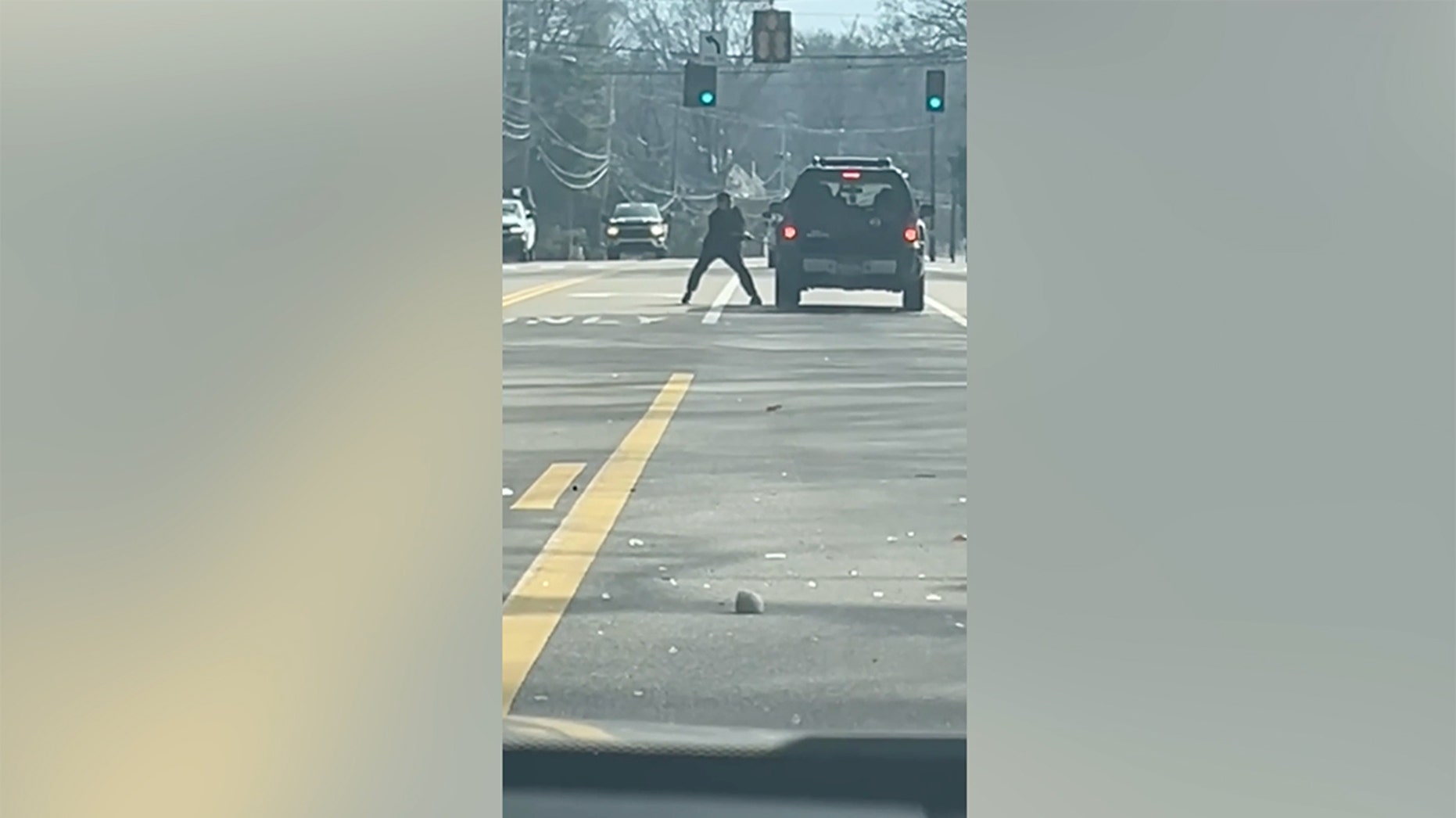 Police searching for ax-wielding suspect caught on camera attacking car in apparent road rage incident