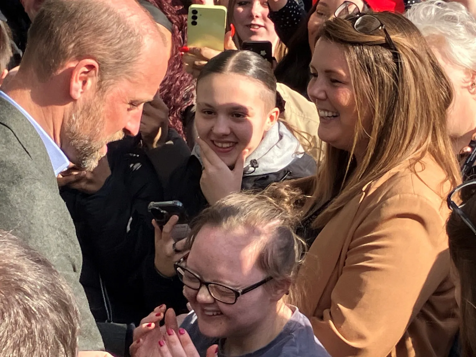 Prince William hugs student on visit to Poole college