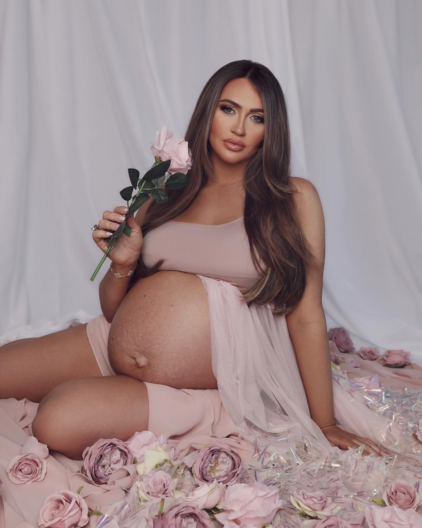 Pregnant Charlotte Dawson shows off huge baby bump as she posed for glam shoot just days before due date...