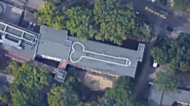 School tries to cover huge 65 foot penis on roof that is visible from space