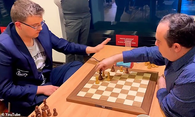 Moment furious Polish chess master falls off his chair after blunder