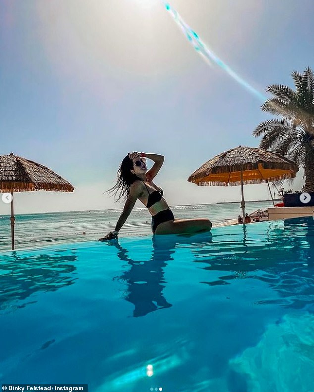 Binky Felstead shows off her toned physique in a black bikini