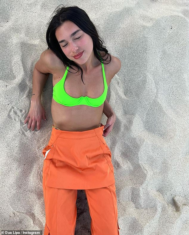 Newly single Dua Lipa flaunts slim physique in neon green bra top