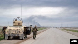 Mass grave of Kurdish fighters killed by IS found in Iraq's disputed province