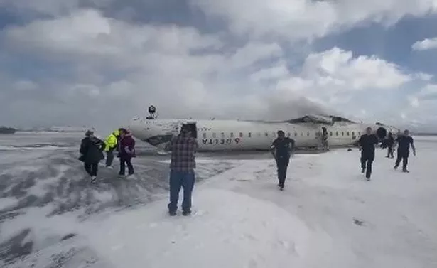 Horror as plane flips upside down while landing at Toronto airport