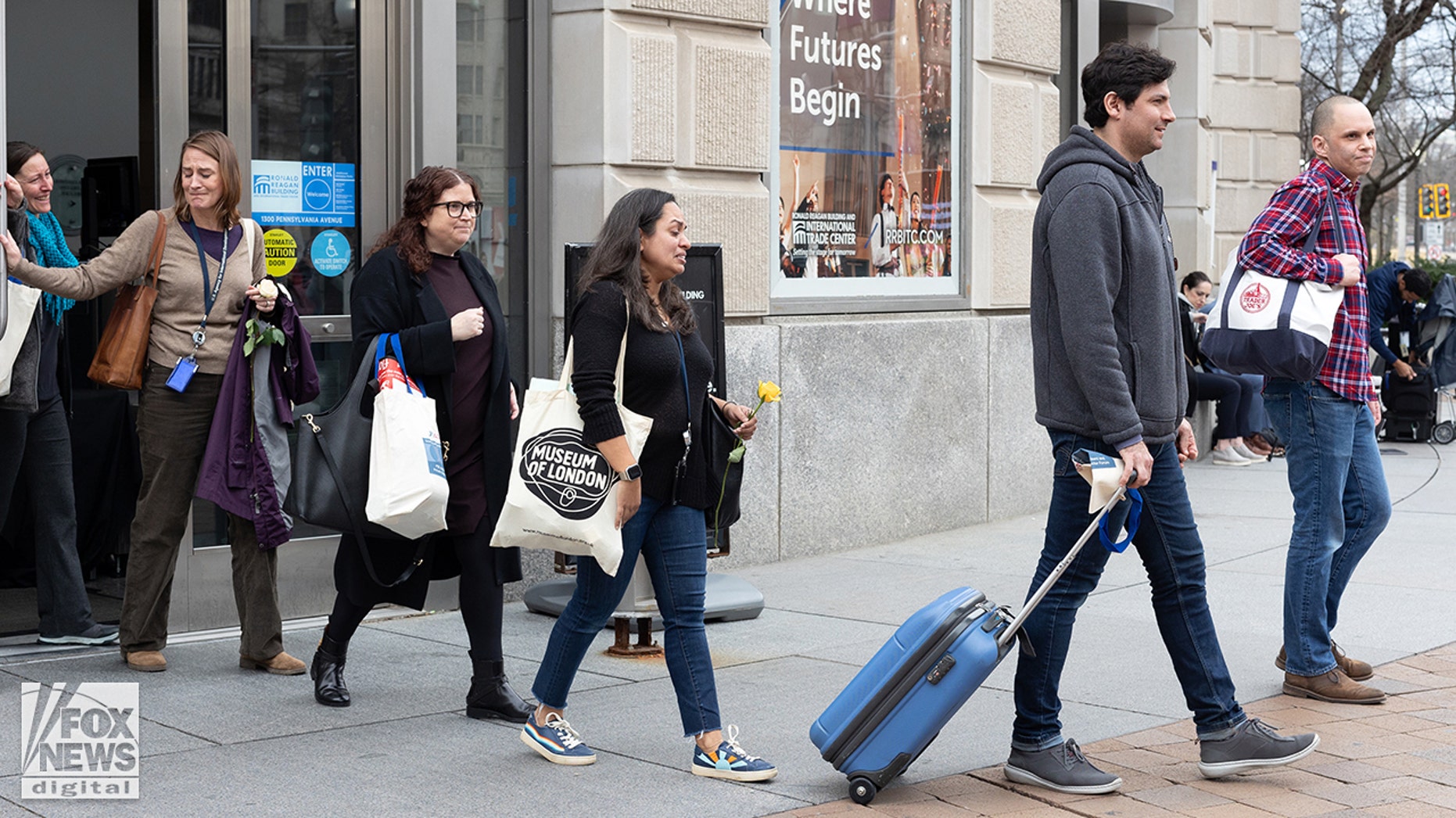 'Fired me illegally': Emotional ex-USAID employees leave building with belongings after mass layoffs