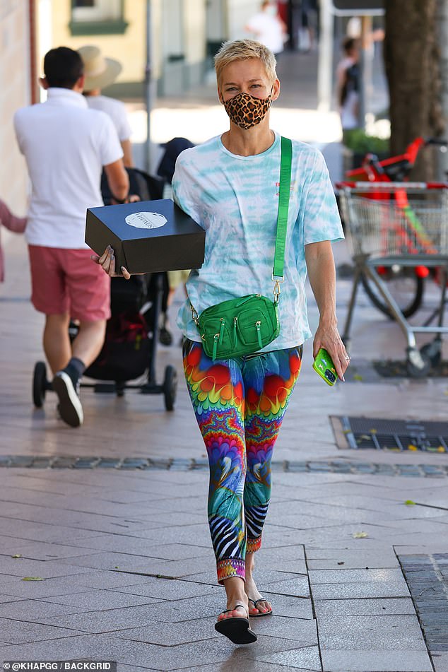 Jessica Rowe picks up a cake in Rose Bay, Sydney, on New Year's Eve