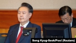 South Korea's Yoon makes 2 court appearances