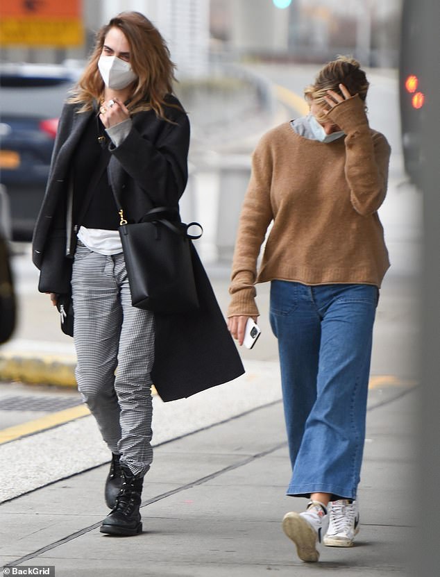 Cara Delevingne and friend Sienna Miller land together at JFK Airport