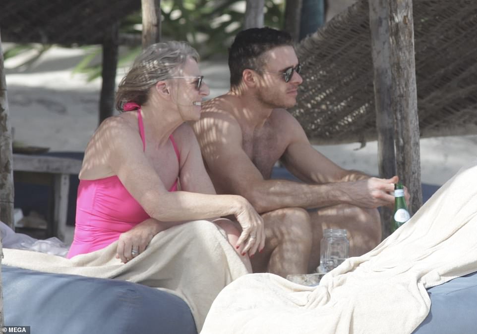 Richard Madden relaxes on the beach with his mother Pat in Mexico