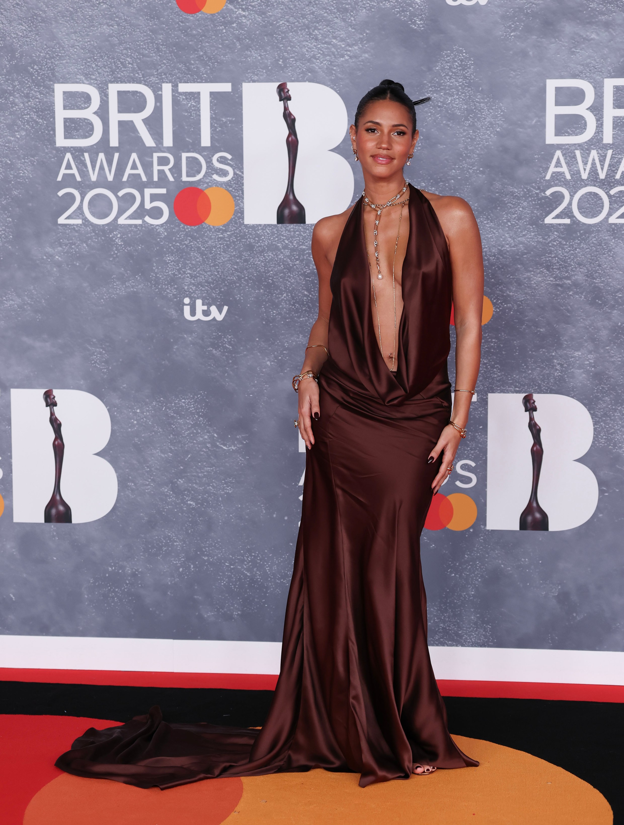 Vick Hope looks incredible in daring plunging dress as she cosies up to husband Calvin Harris at the BRITs...