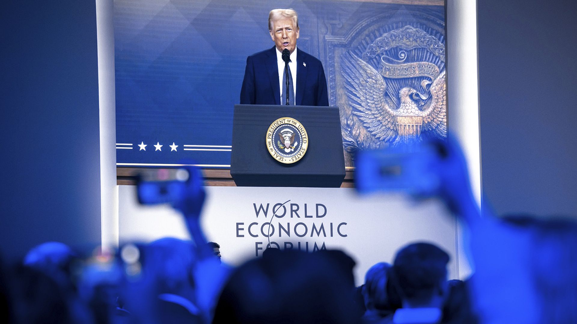 Invest in US or face tariffs, Trump tells Davos