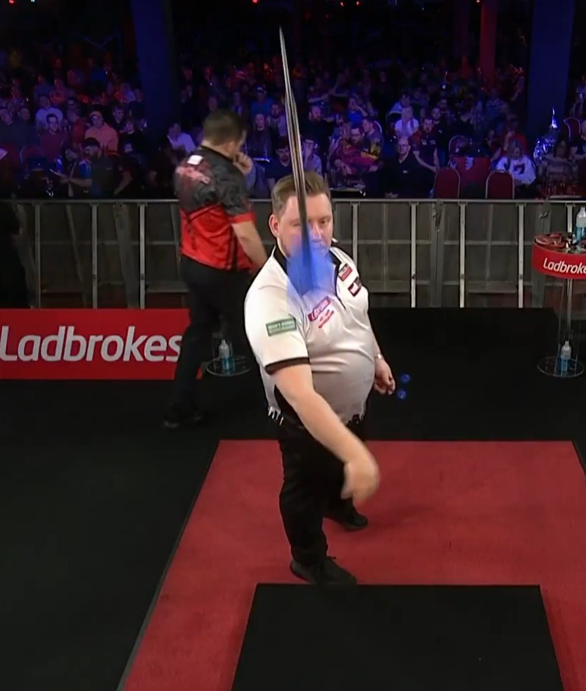 Martin Schindler forced to pull dart out of his foot as UK Darts Open board gets ‘violent’...