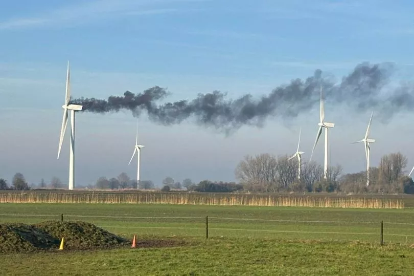 UK wind turbine bursts into flames filling sky with plume of smoke