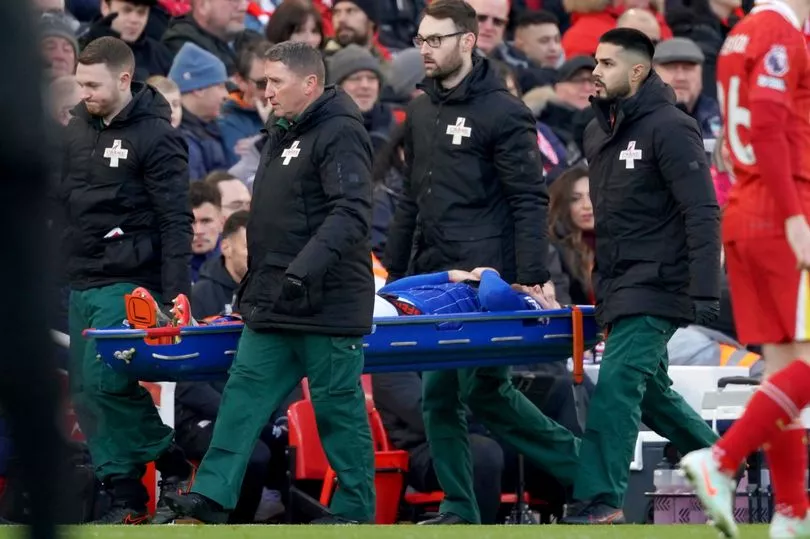 Ipswich star stretchered off against Liverpool after collapsing to the ground