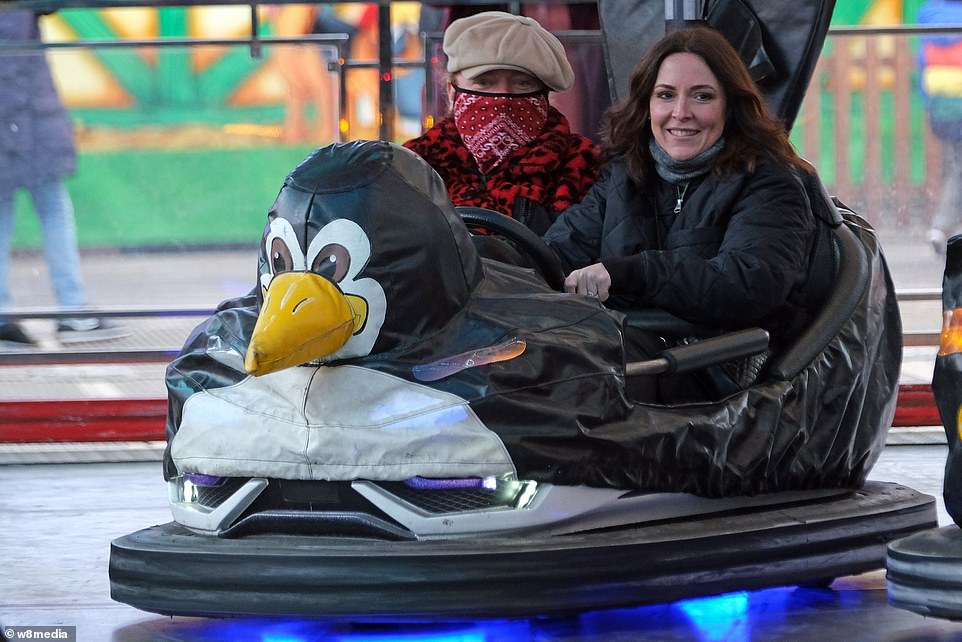 Keith Lemon cosies up to wife Jill Carter on bumper cars